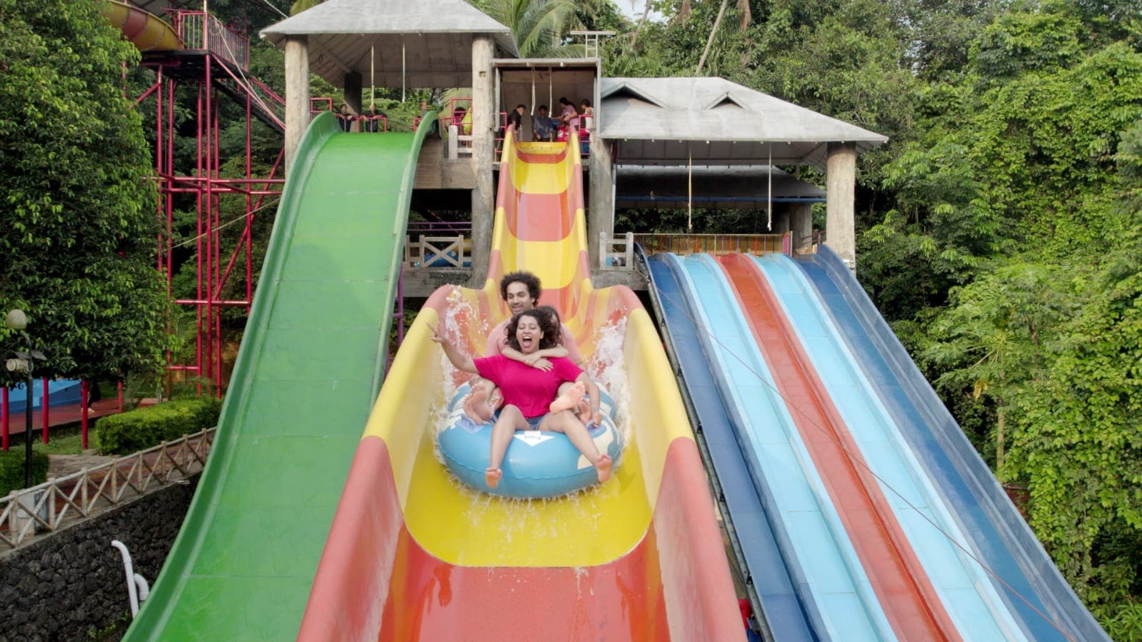 School students enjoying water slides at Flora Fantasia amusement park Malappuram Kerala school trip